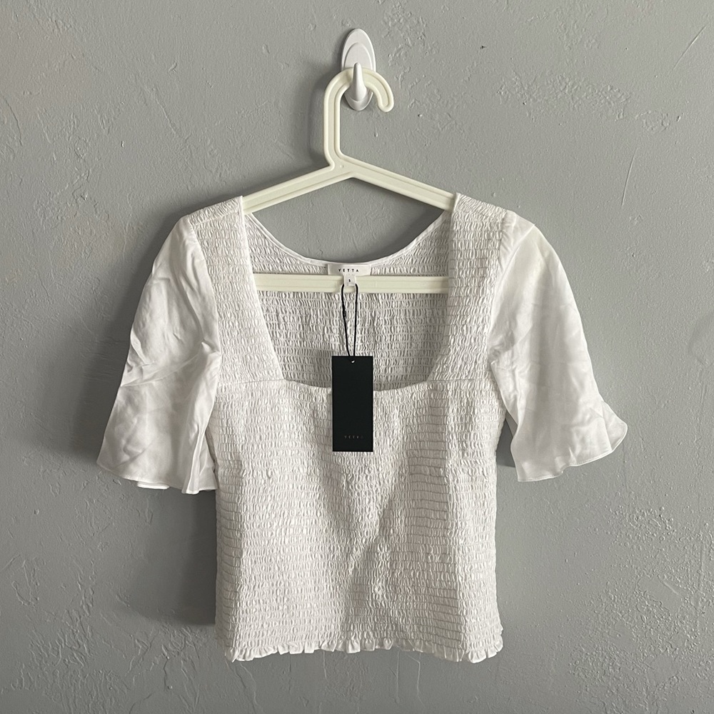 The Smocked Flutter Sleeve Blouse